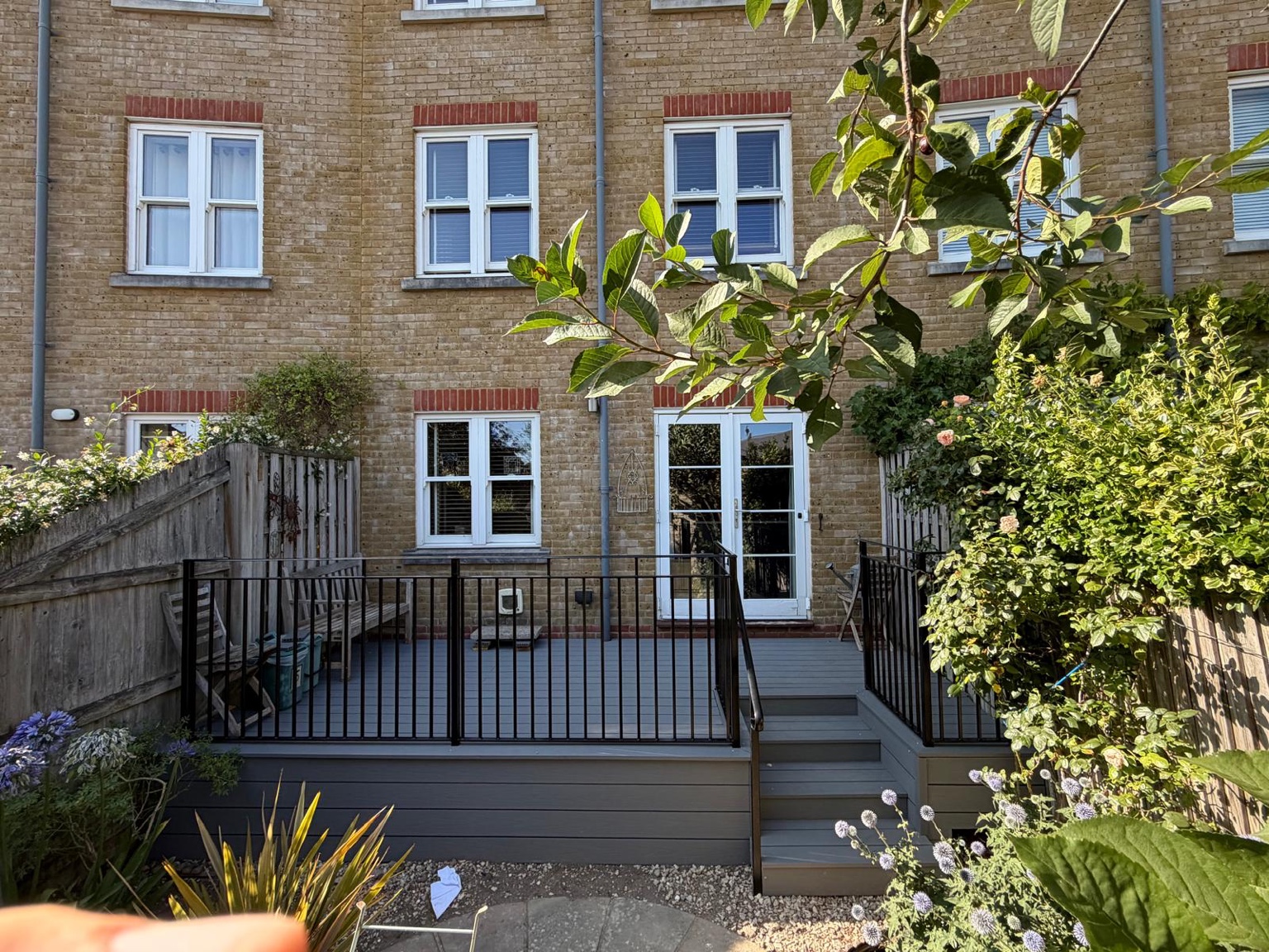 View of the completed Deal decking, railings and steps from the garden