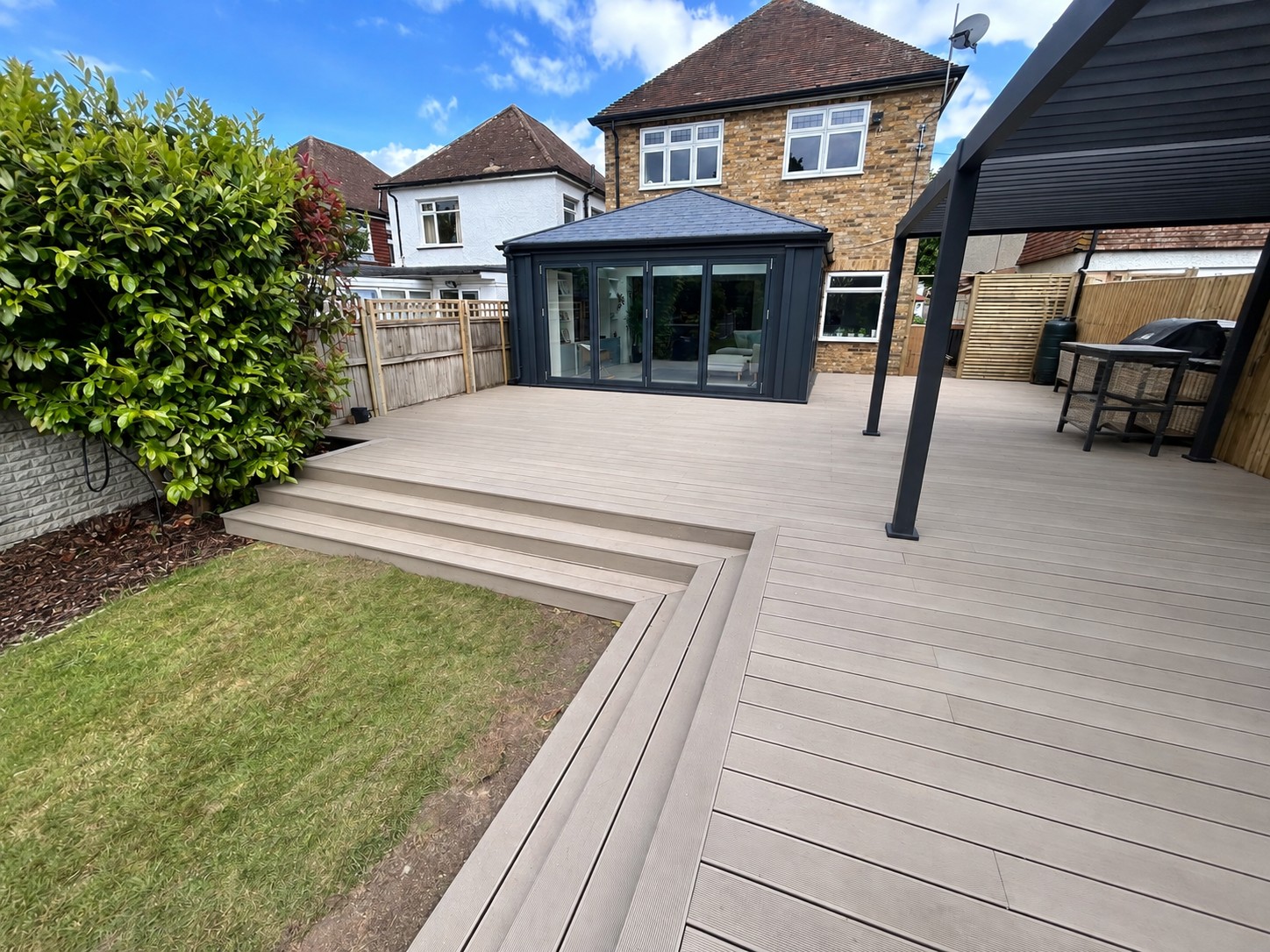 Sittingbourne decking terrace with steps leading to the lawn
