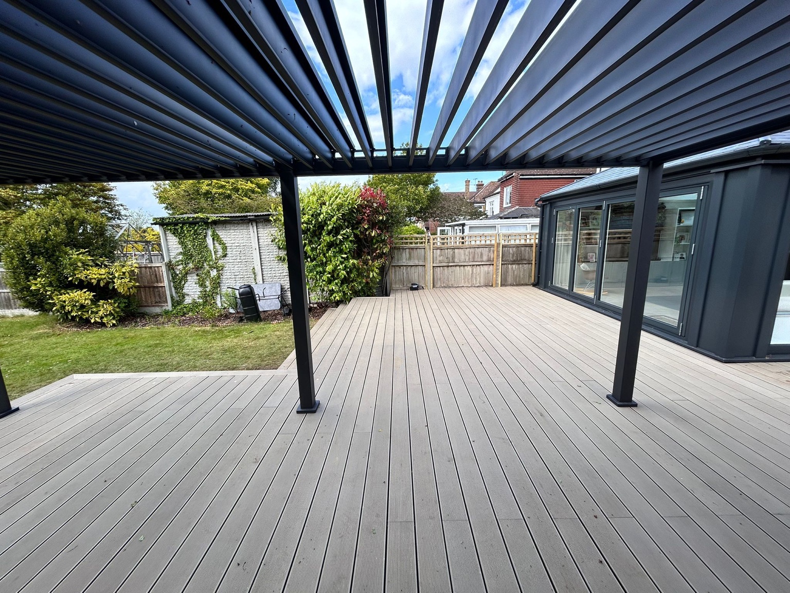 The deck connects the house with the garden seating area.
