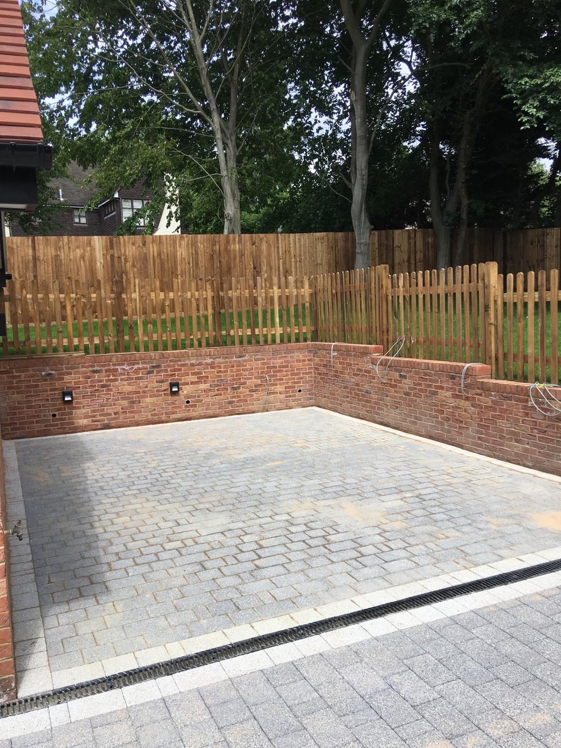 Block paving, brick walls and picket fencing in West Malling